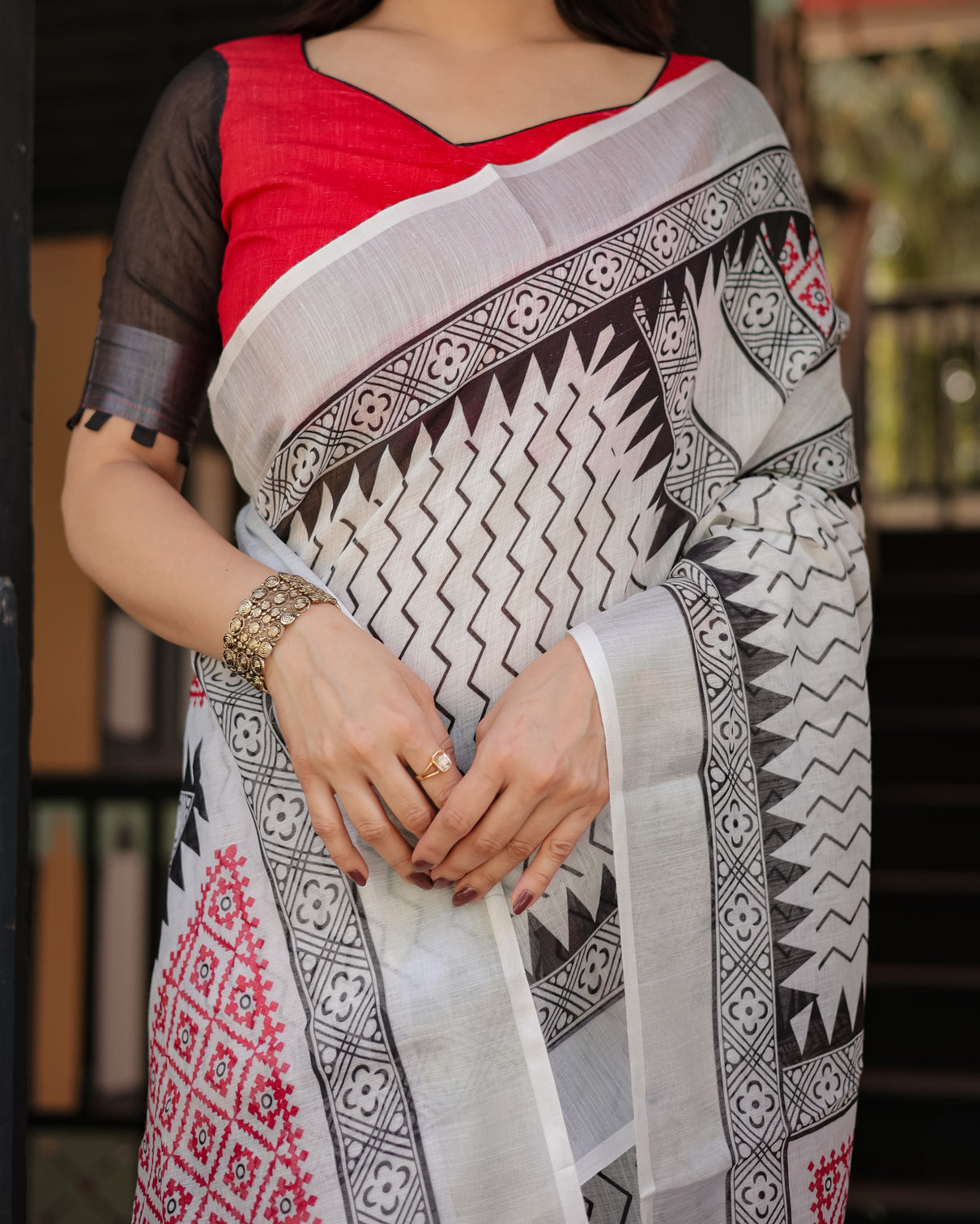 Black and white geometric pattern pure cotton linen saree with red accents blouse and tassel details