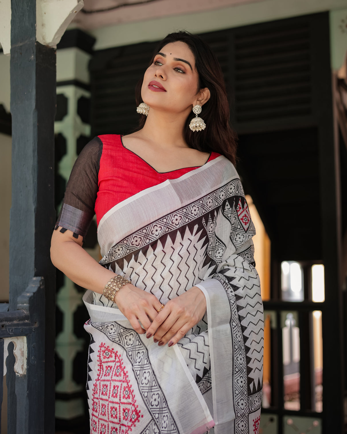 Black and white geometric pattern pure cotton linen saree with red accents blouse and tassel details