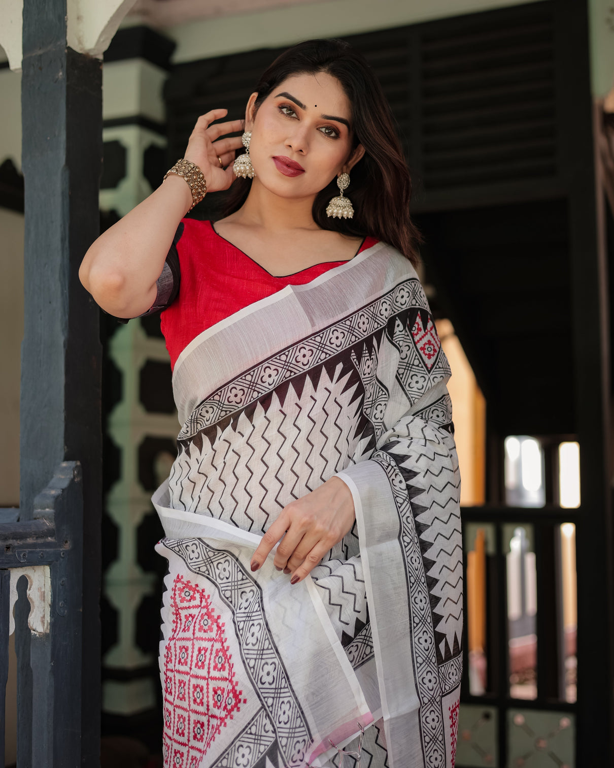 Black and white geometric pattern pure cotton linen saree with red accents blouse and tassel details