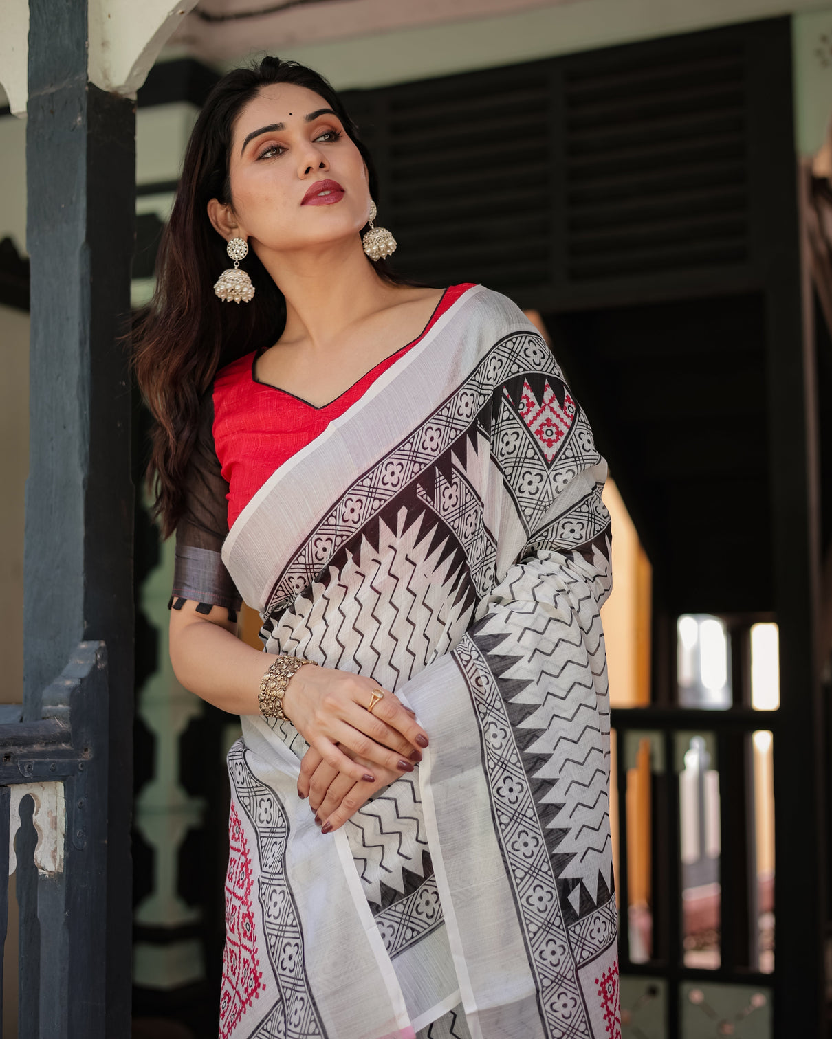 Black and white geometric pattern pure cotton linen saree with red accents blouse and tassel details