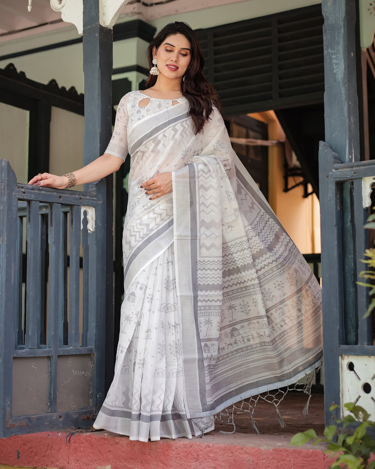 Elegant pure cotton linen saree with intricate grey and white pattern complete with blouse and tassels