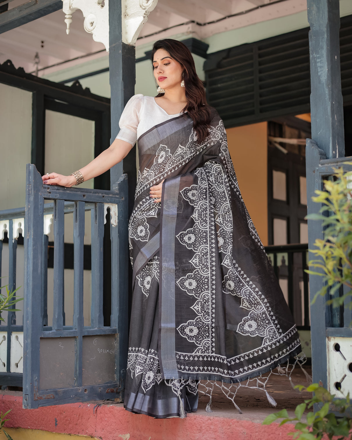 Black and white pure cotton linen saree with intricate floral design and tassels on edges mameraa
