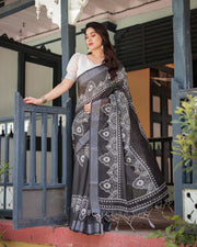 Black and white pure cotton linen saree with intricate floral design and tassels on edges mameraa