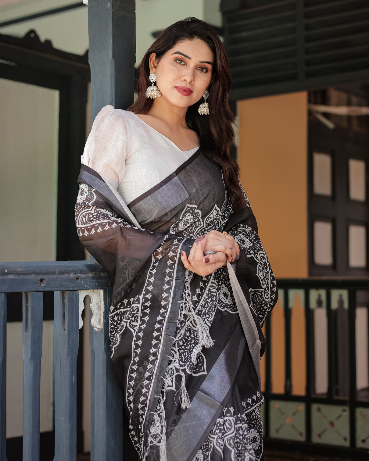Black and white pure cotton linen saree with intricate floral design and tassels on edges