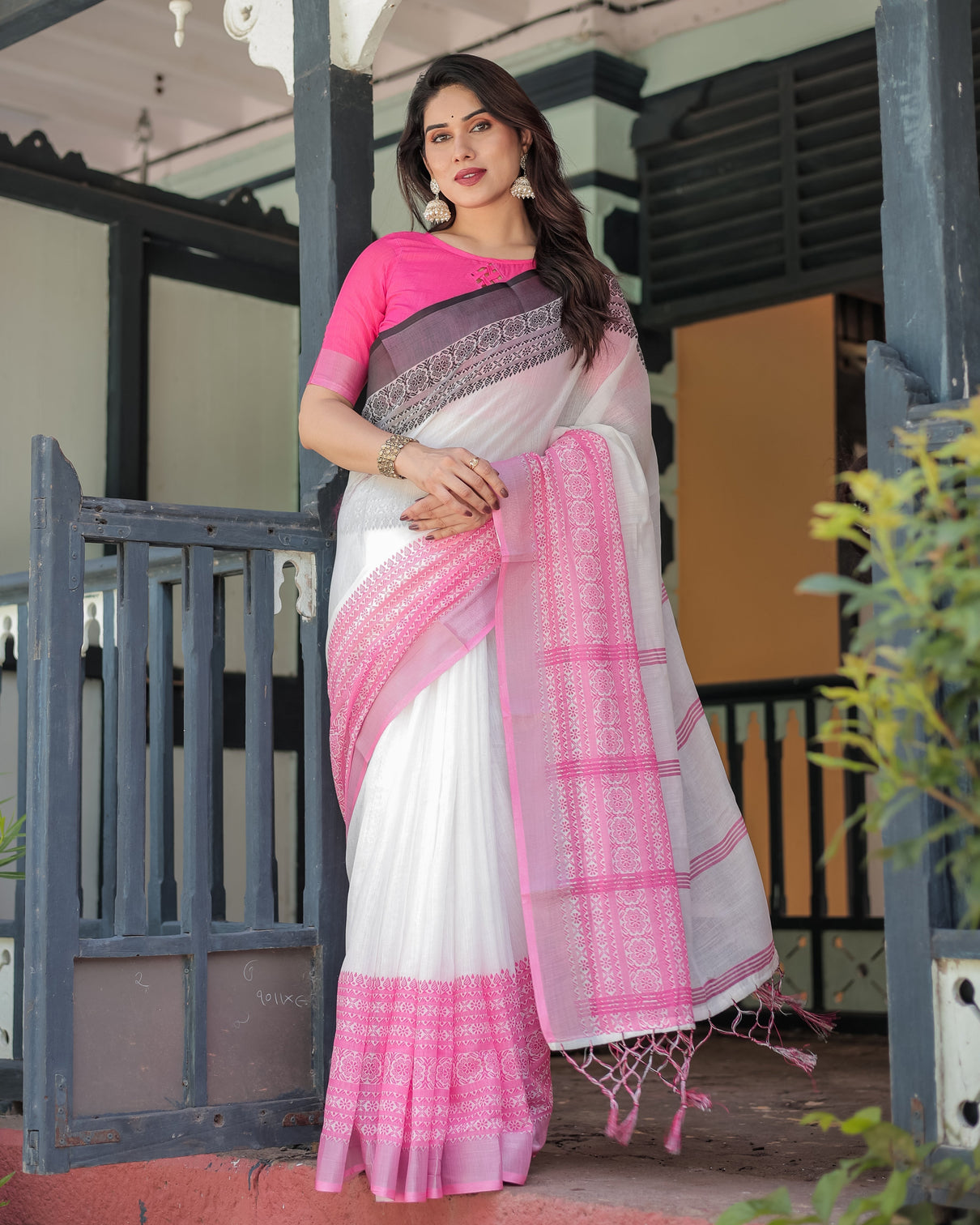 Elegant white and pink pure cotton linen saree with intricate floral and geometric border design and tassels on edges mameraa
