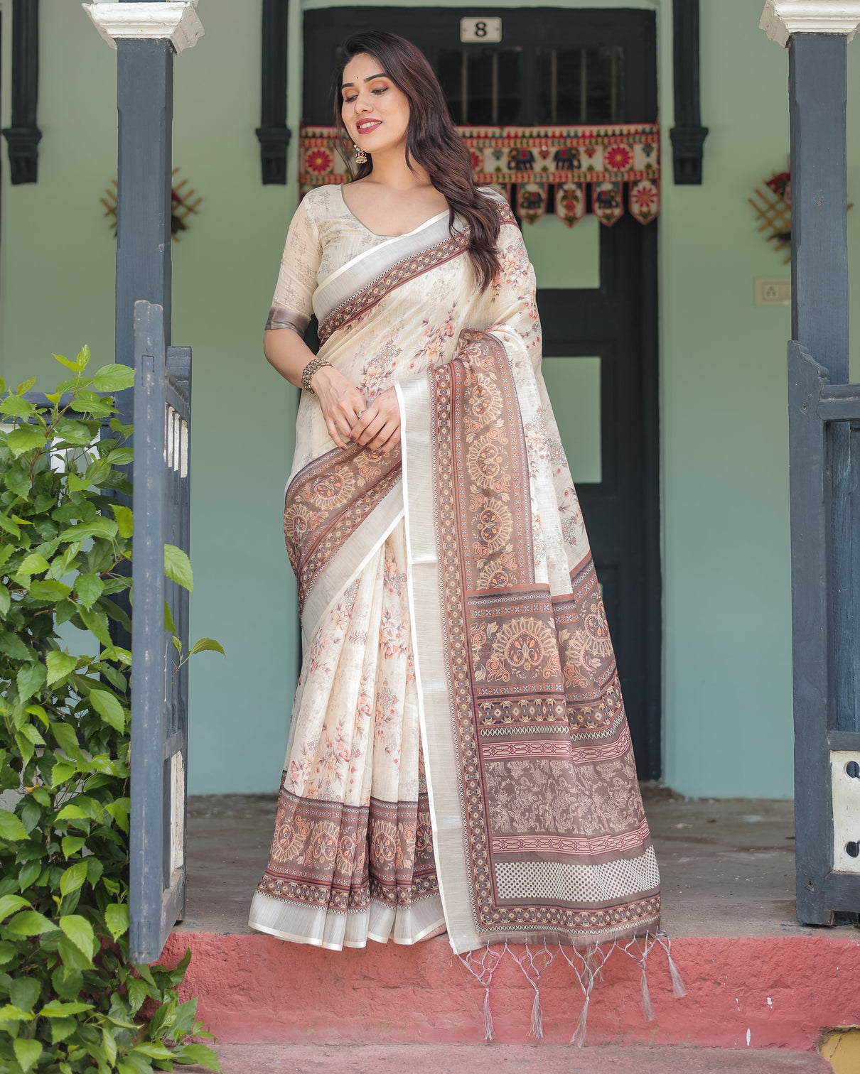 Cream and brown floral print pure cotton linen saree with blouse and tassels on edges