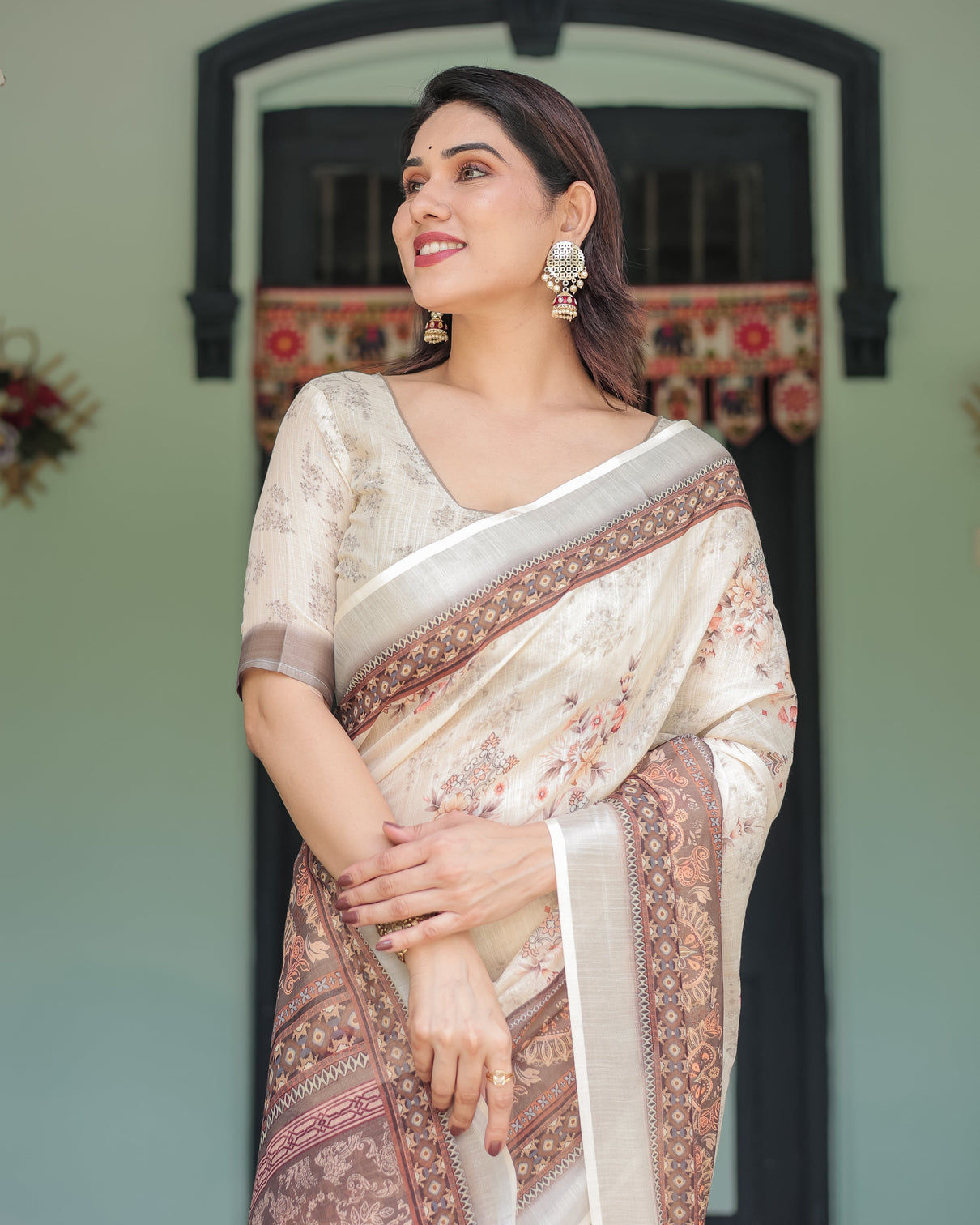 Cream and brown floral print pure cotton linen saree with blouse and tassels on edges