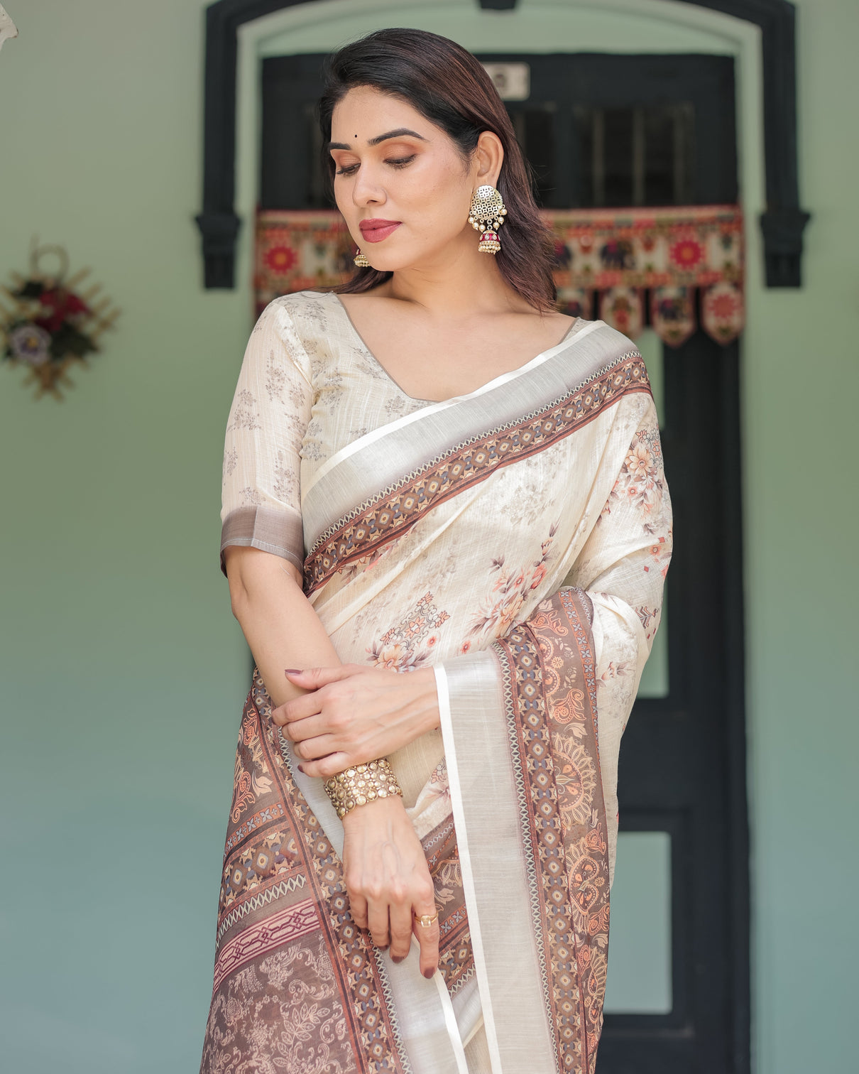 Cream and brown floral print pure cotton linen saree with blouse and tassels on edges