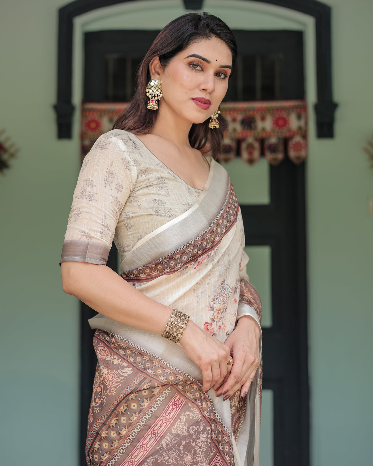 Cream and brown floral print pure cotton linen saree with blouse and tassels on edges