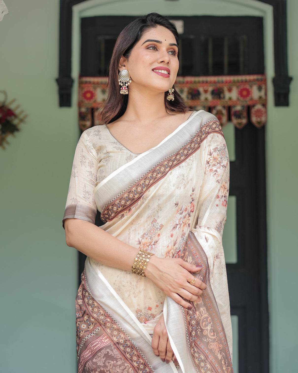 Cream and brown floral print pure cotton linen saree with blouse and tassels on edges