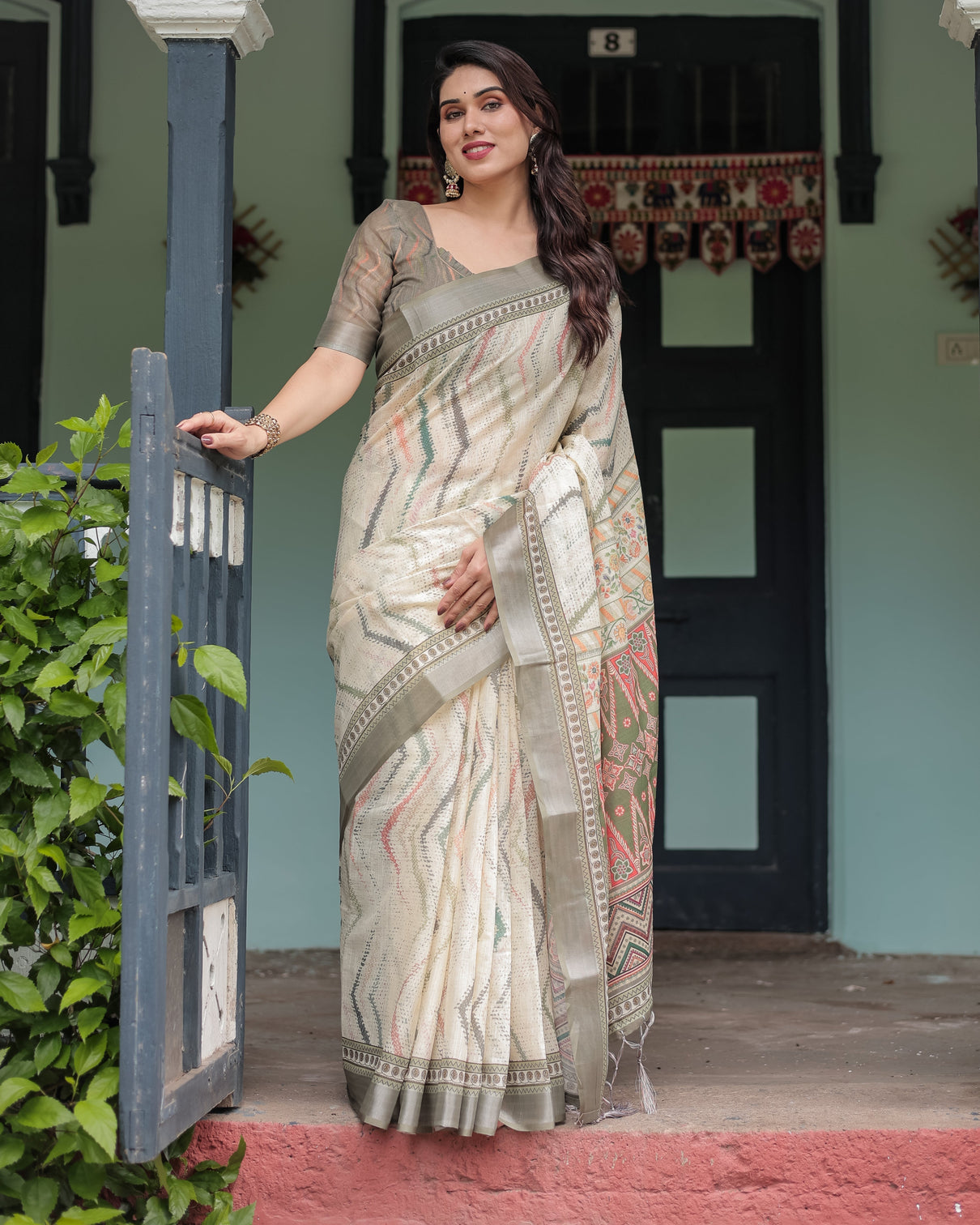 Cream and olive green pure cotton linen saree with floral and geometric print and tassels on edges mameraa