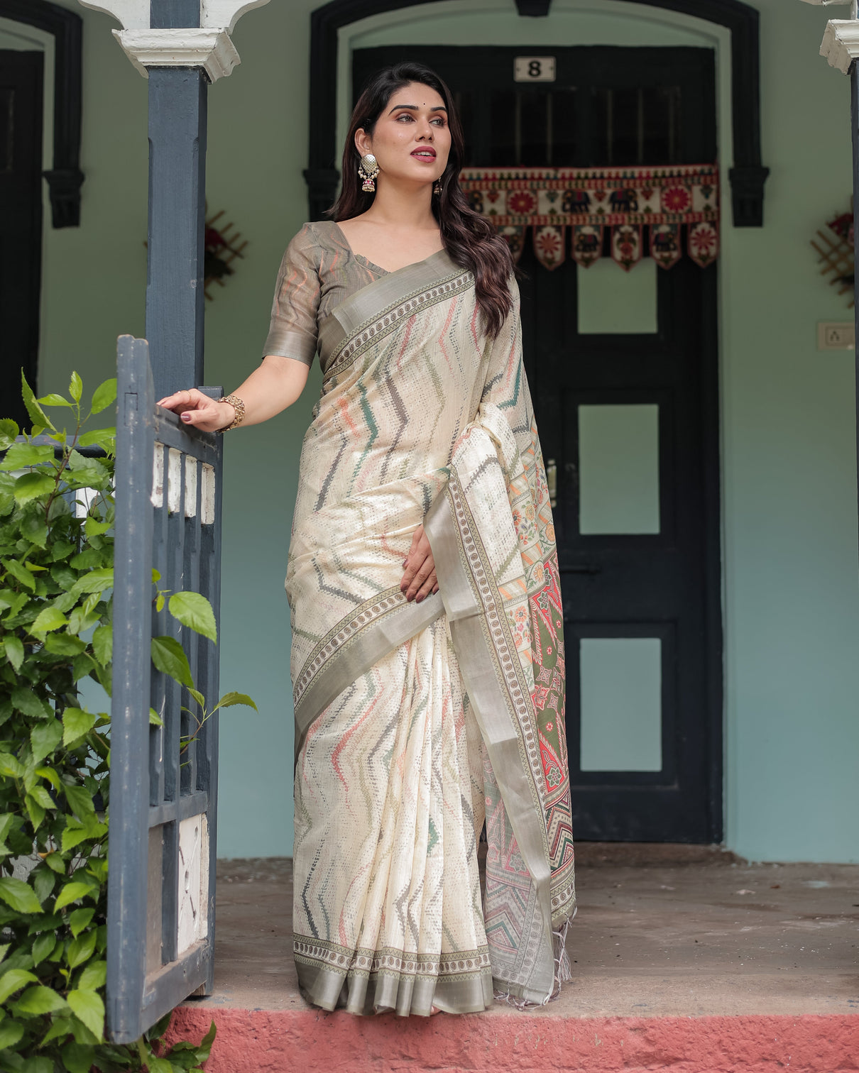 Cream and olive green pure cotton linen saree with floral and geometric print and tassels on edges
