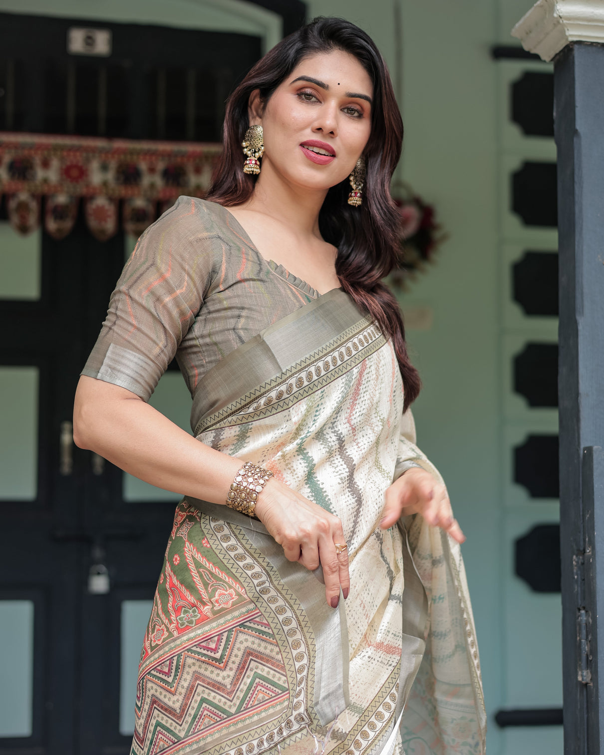 Cream and olive green pure cotton linen saree with floral and geometric print and tassels on edges