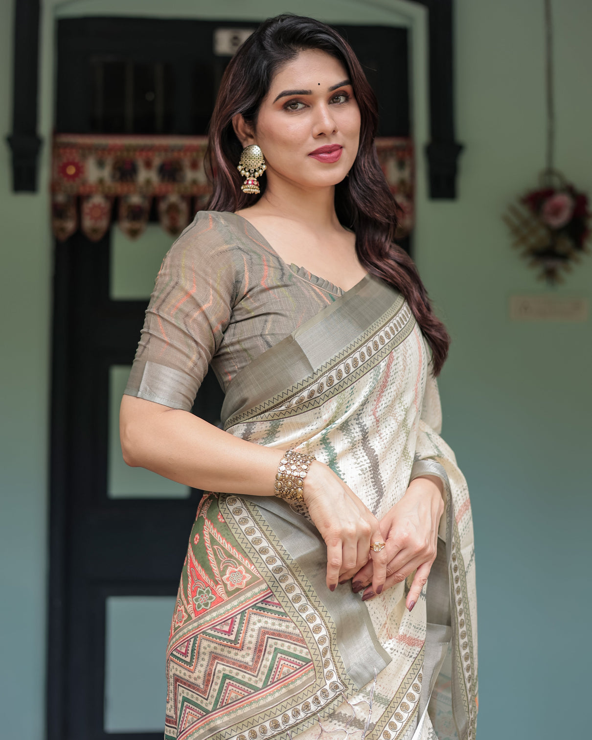 Cream and olive green pure cotton linen saree with floral and geometric print and tassels on edges