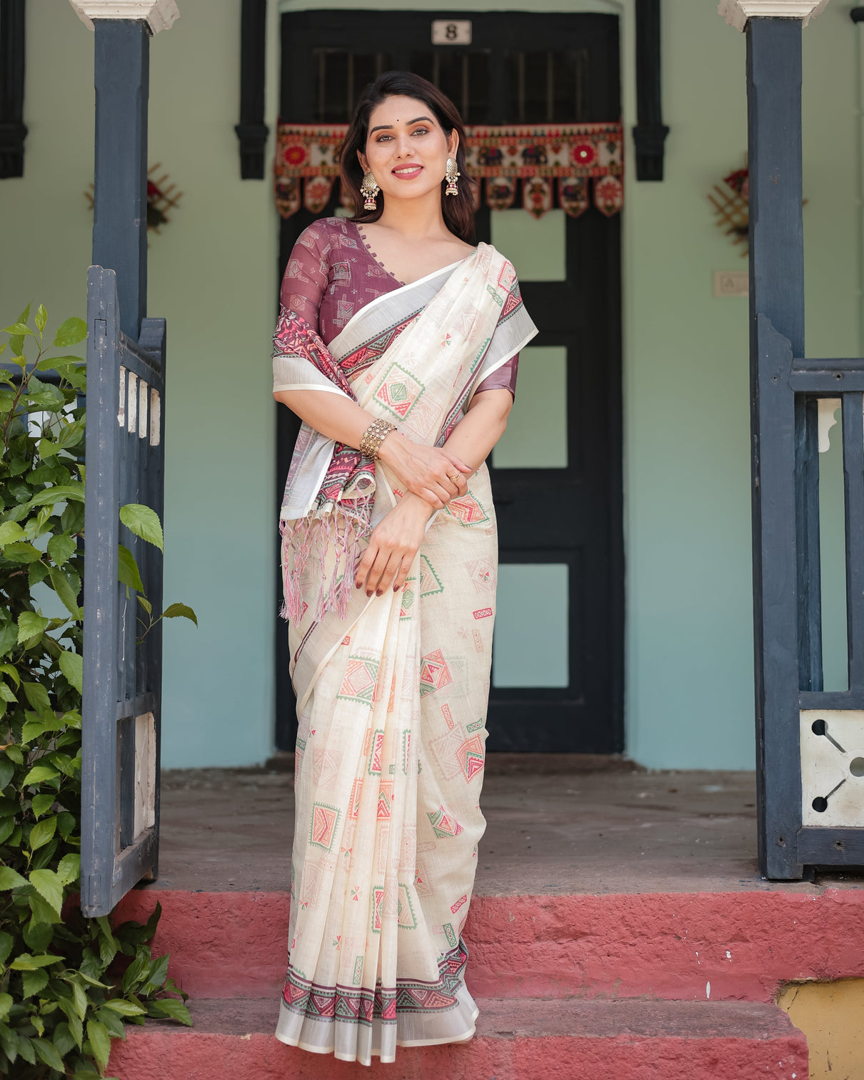 Off white pure cotton linen saree with intricate geometric pattern and tassels on edges