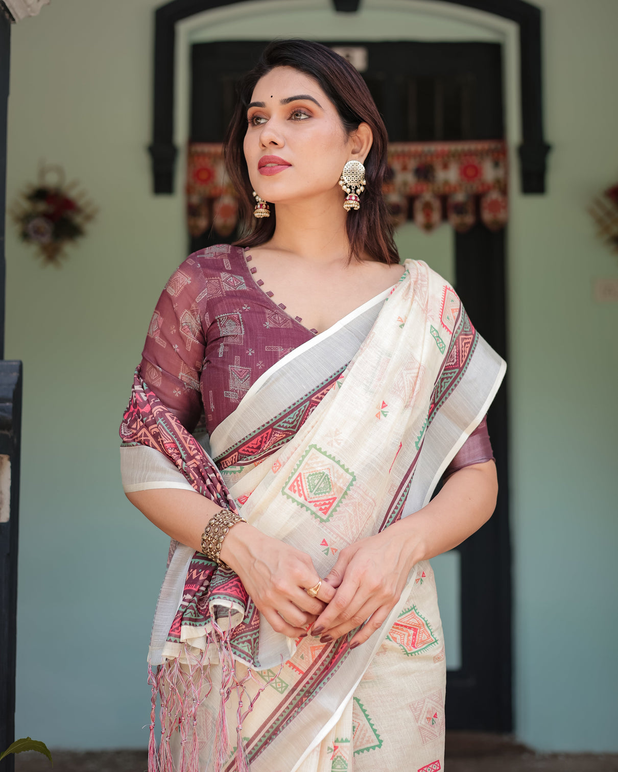 Off white pure cotton linen saree with intricate geometric pattern and tassels on edges