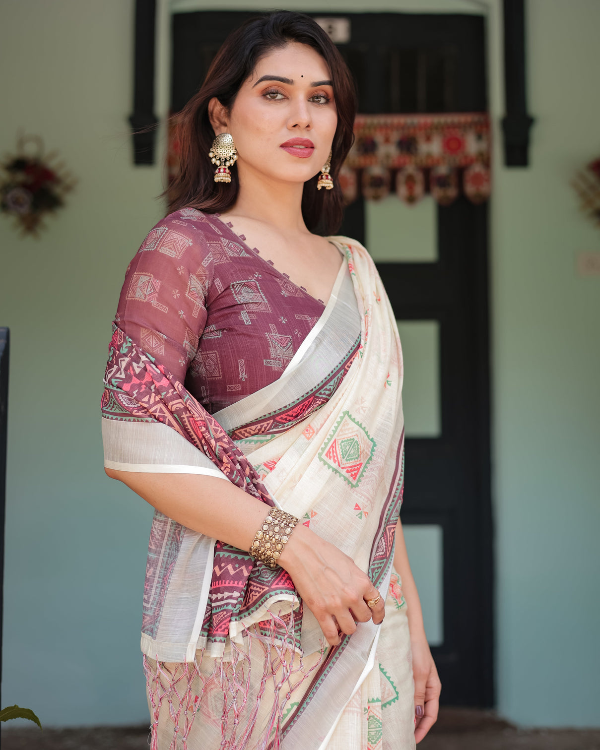 Off white pure cotton linen saree with intricate geometric pattern and tassels on edges
