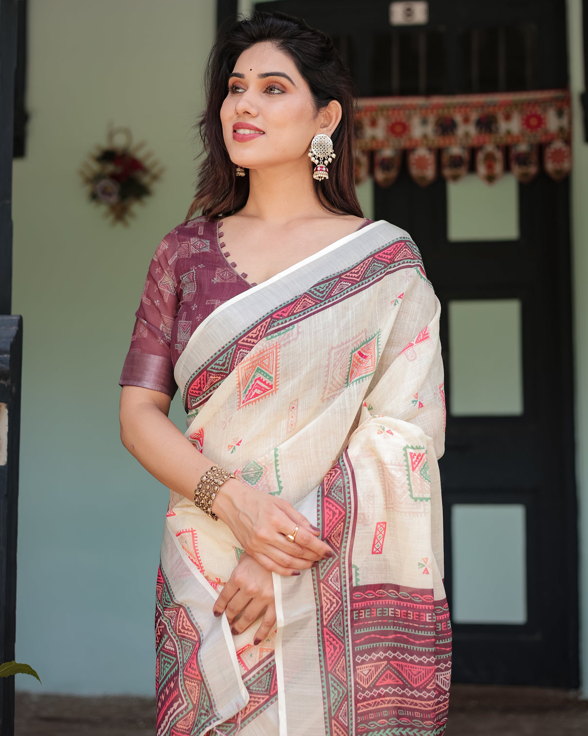 Off white pure cotton linen saree with intricate geometric pattern and tassels on edges