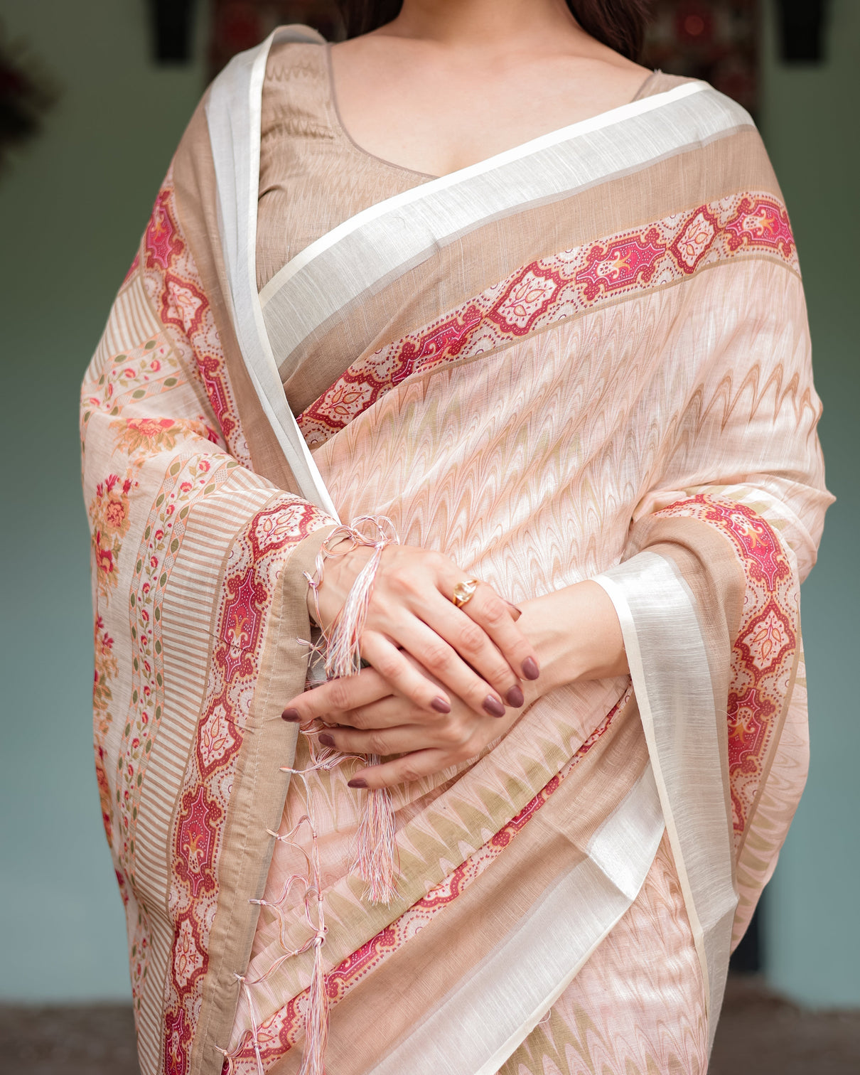 Beige and pink floral printed pure cotton linen saree with blouse and tassels on edges