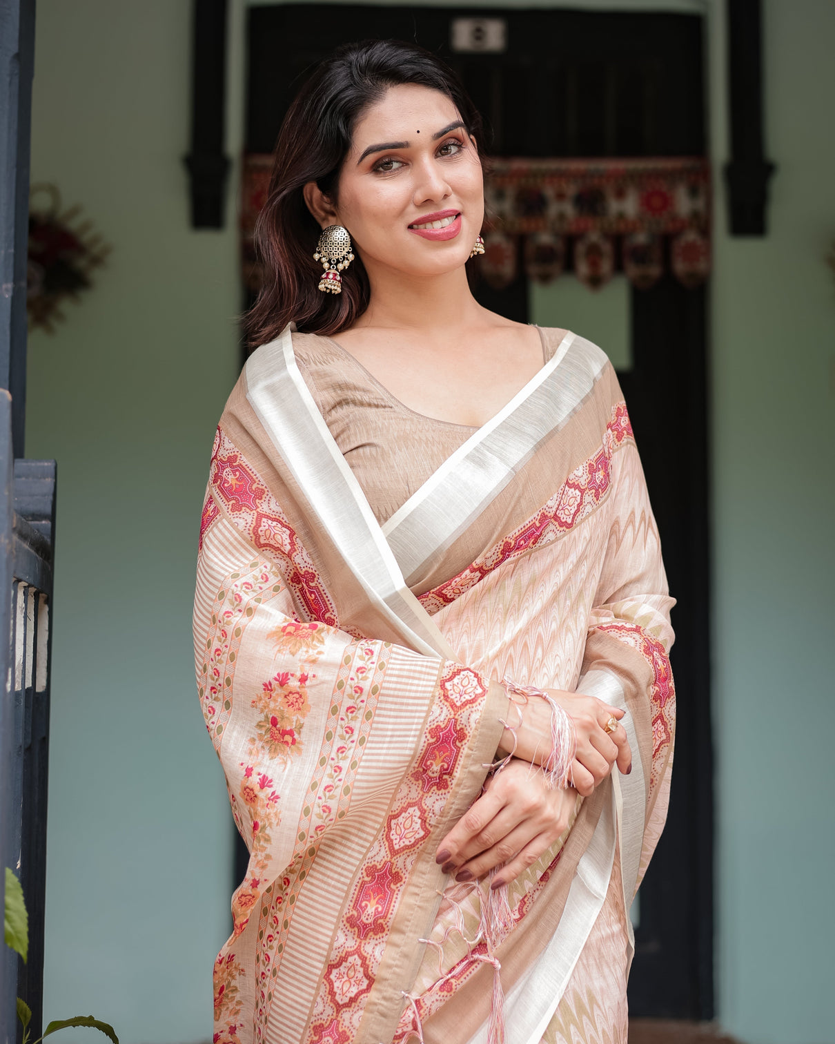 Beige and pink floral printed pure cotton linen saree with blouse and tassels on edges