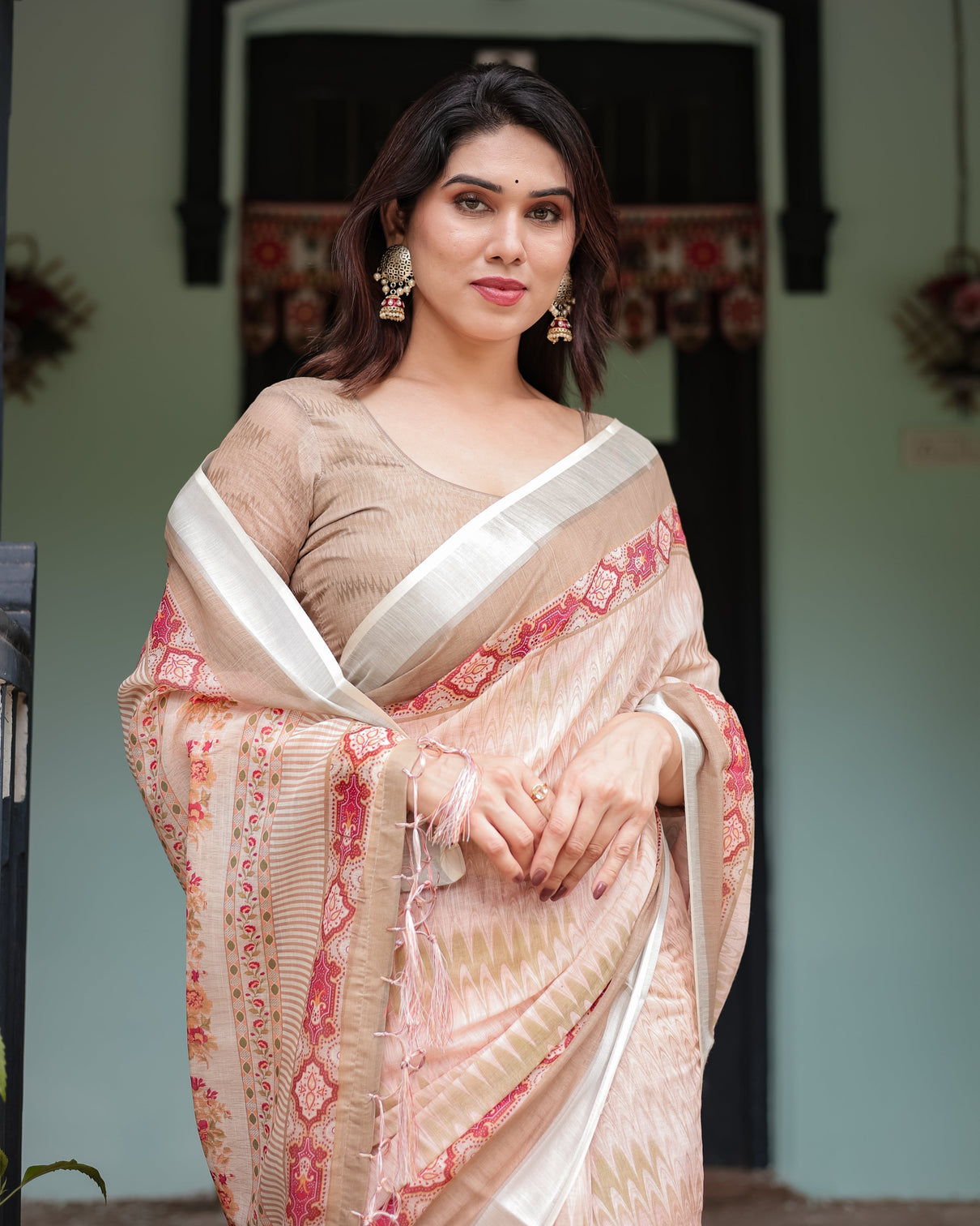 Beige and pink floral printed pure cotton linen saree with blouse and tassels on edges
