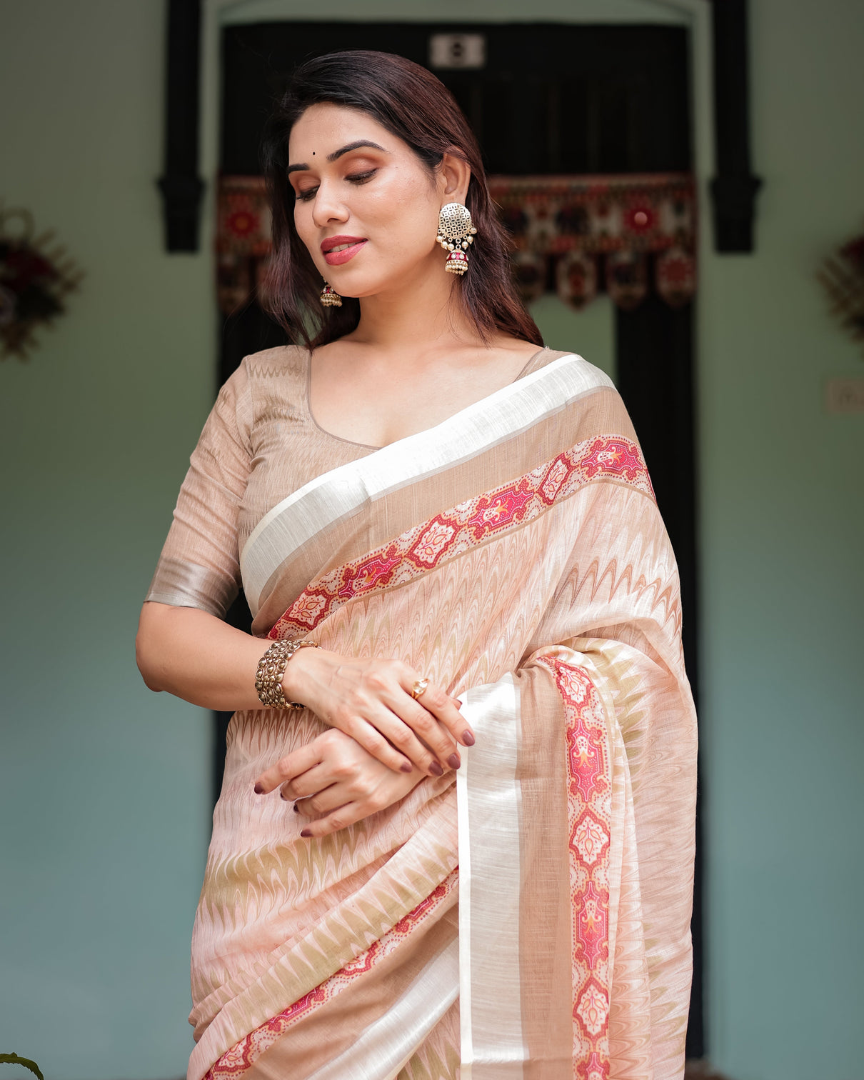 Beige and pink floral printed pure cotton linen saree with blouse and tassels on edges