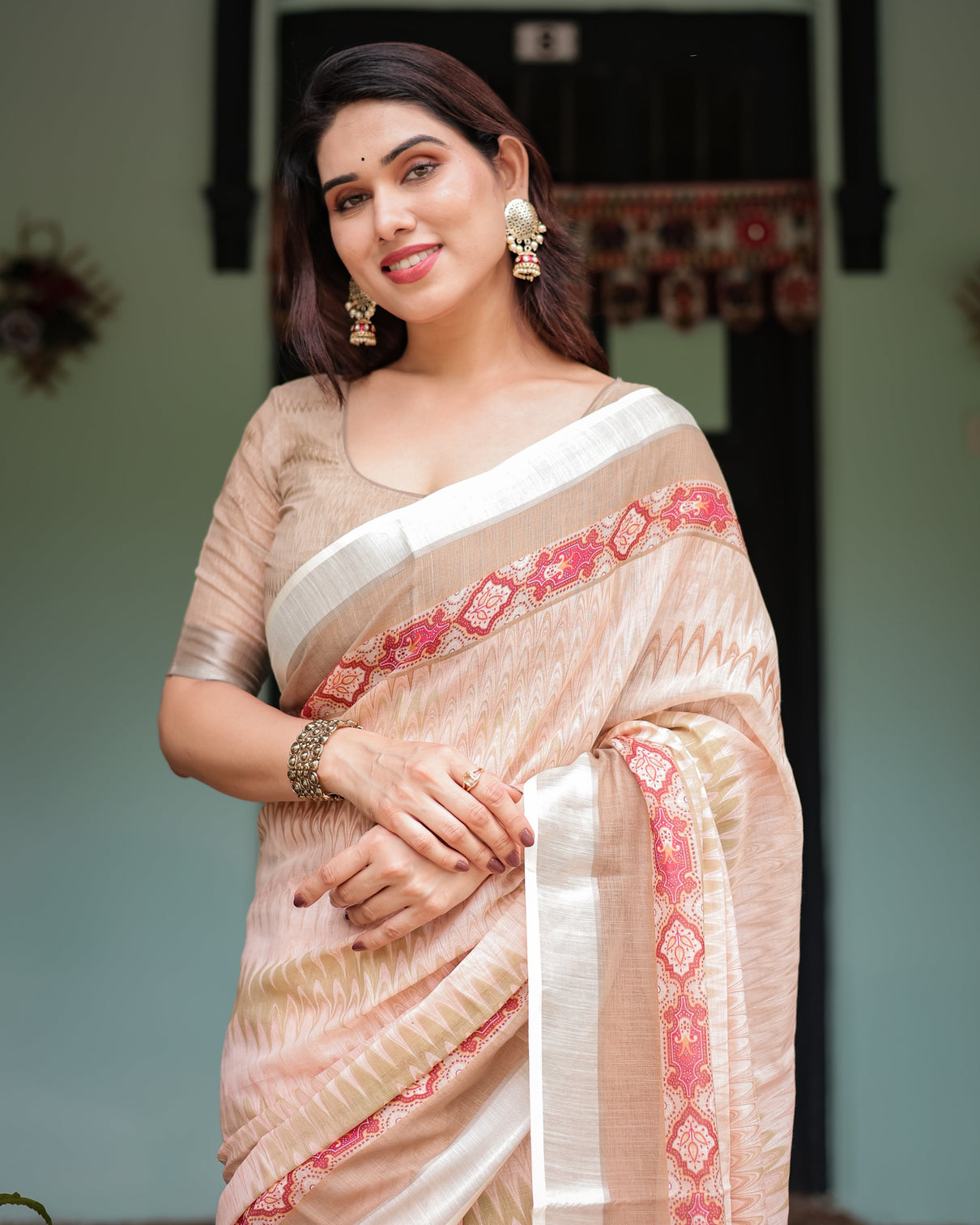 Beige and pink floral printed pure cotton linen saree with blouse and tassels on edges