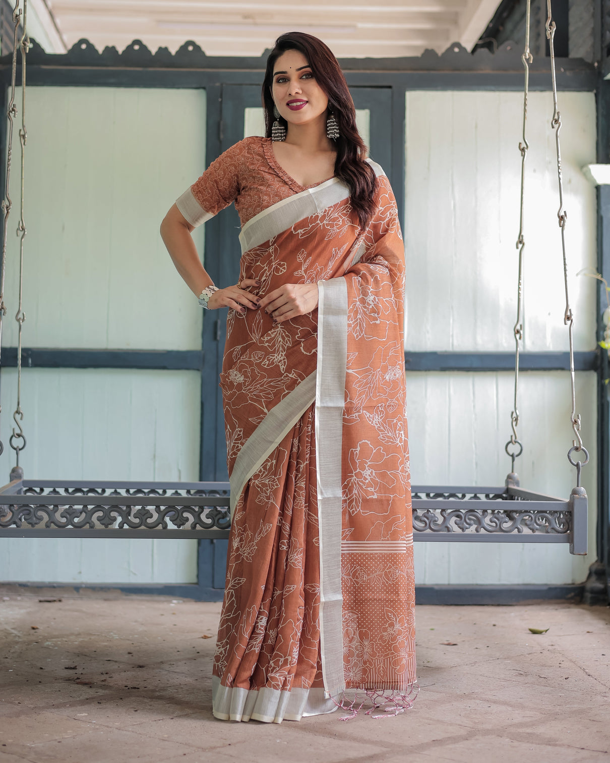 Terracotta brown floral handprinted pure cotton linen saree with tassels