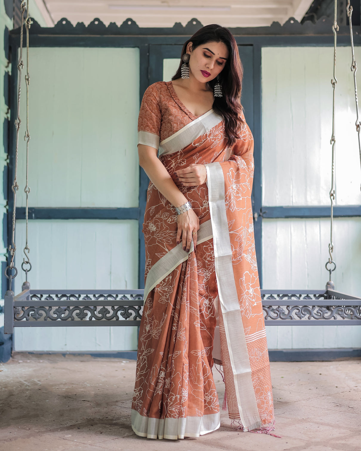 Terracotta brown floral handprinted pure cotton linen saree with tassels