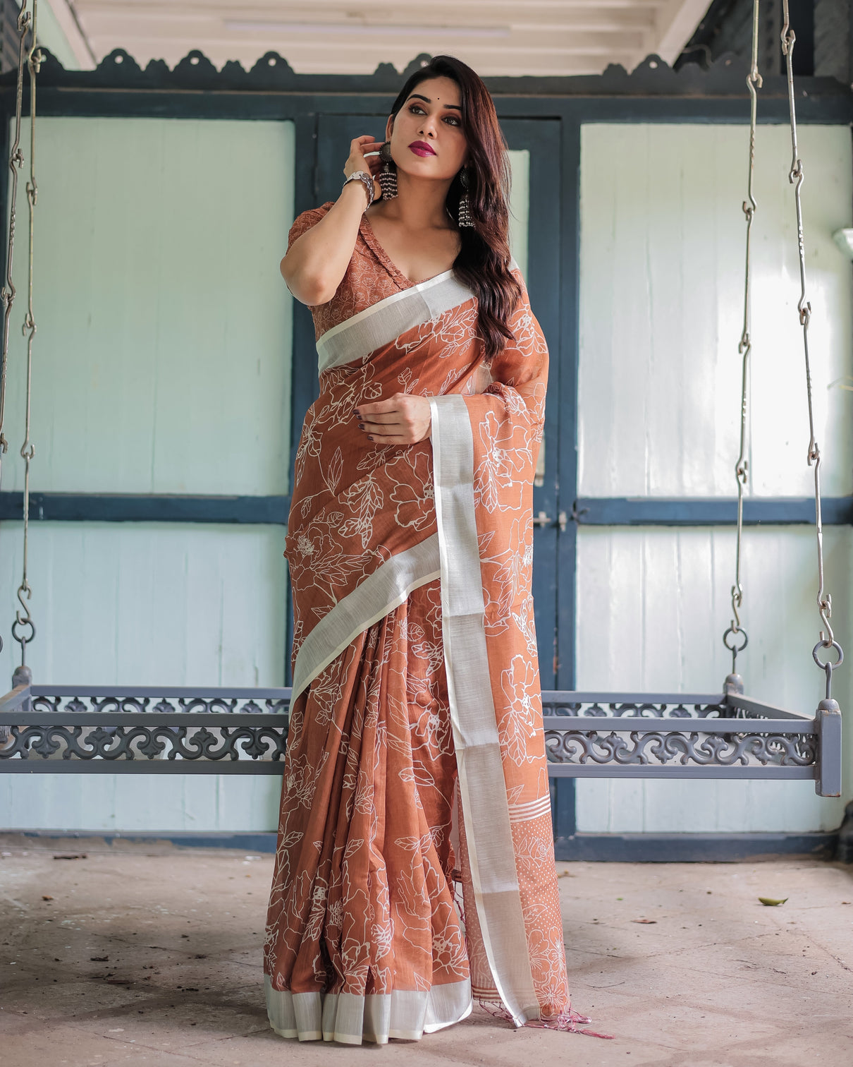 Terracotta brown floral handprinted pure cotton linen saree with tassels