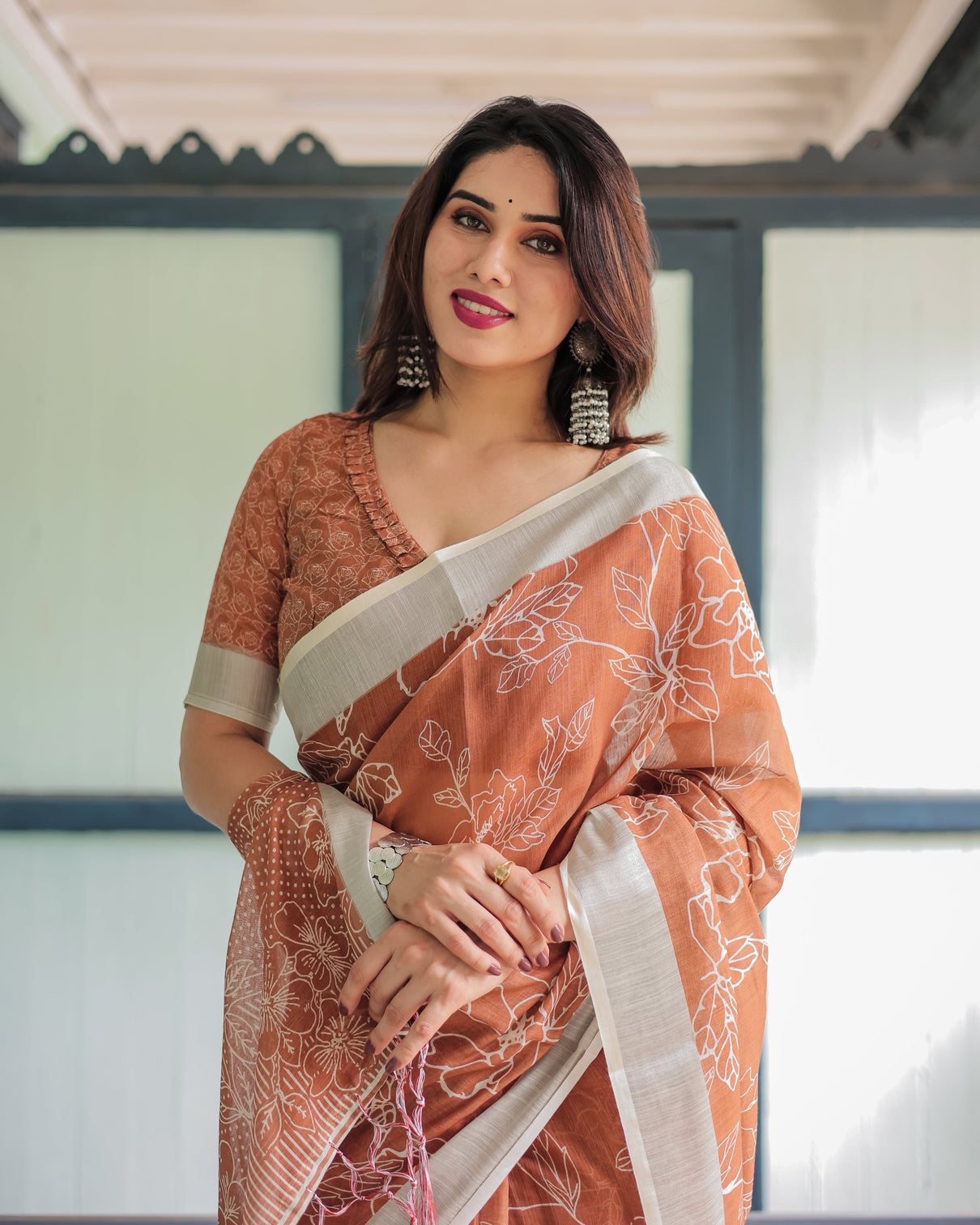 Terracotta brown floral handprinted pure cotton linen saree with tassels