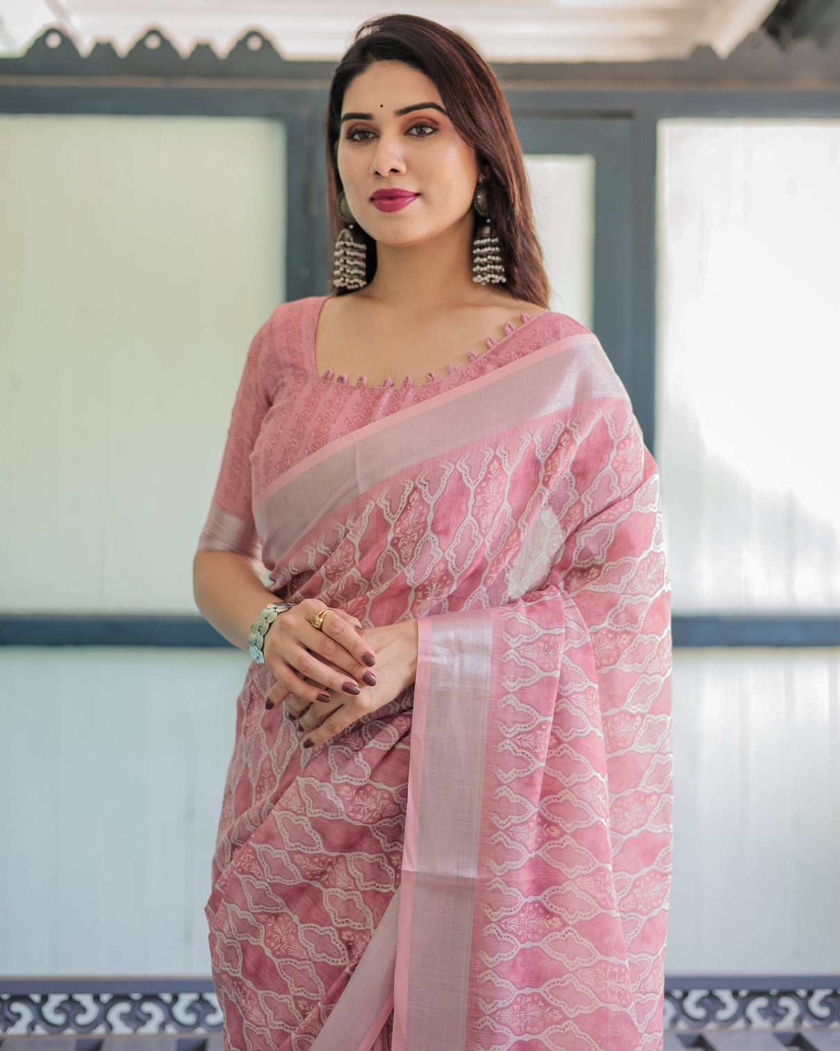 Elegant rose pink pure cotton linen saree with white thread work matching blouse and tassel edges