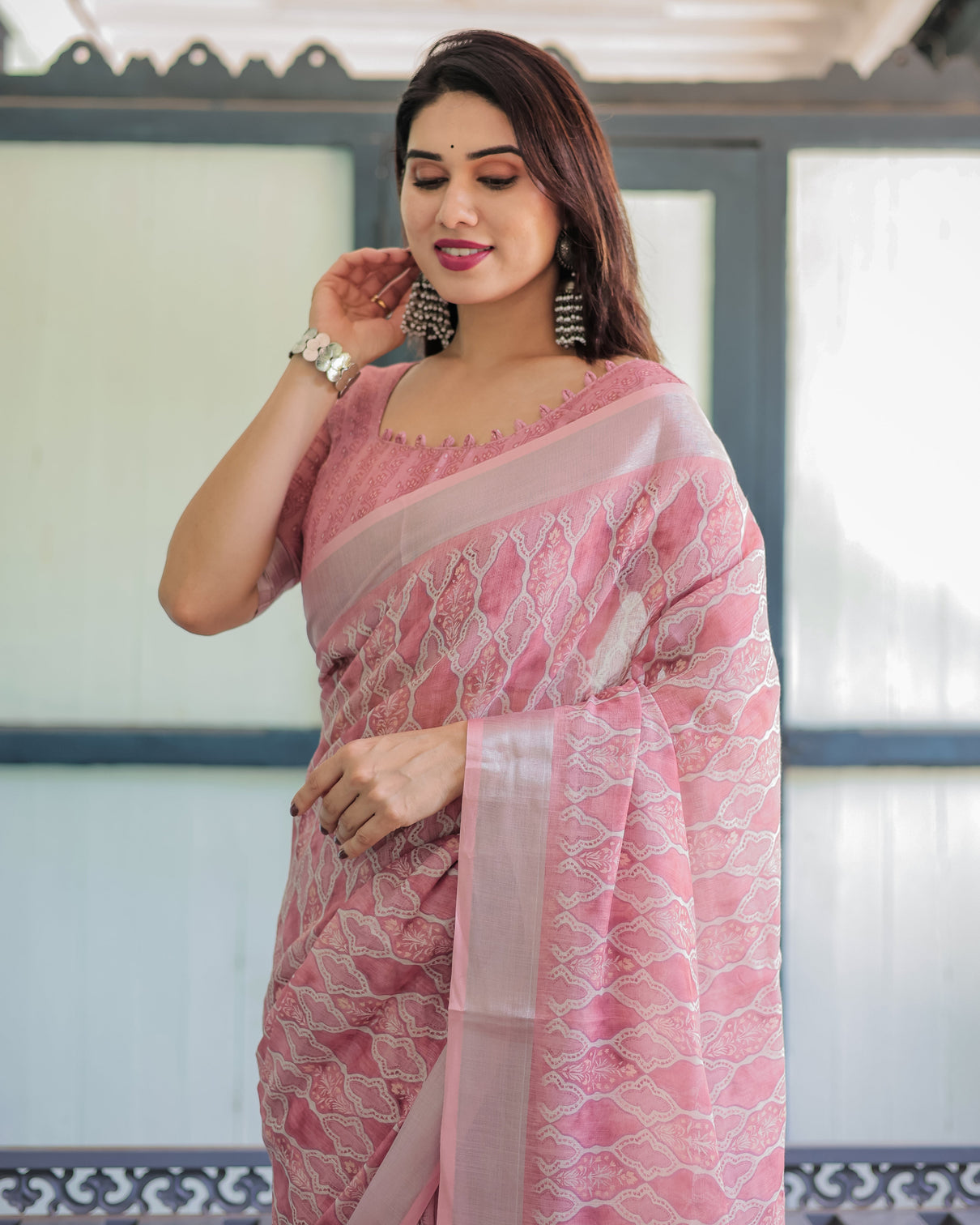 Elegant rose pink pure cotton linen saree with white thread work matching blouse and tassel edges