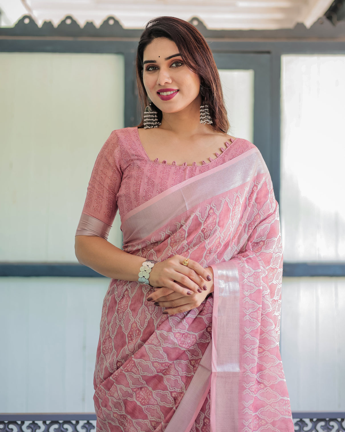 Elegant rose pink pure cotton linen saree with white thread work matching blouse and tassel edges