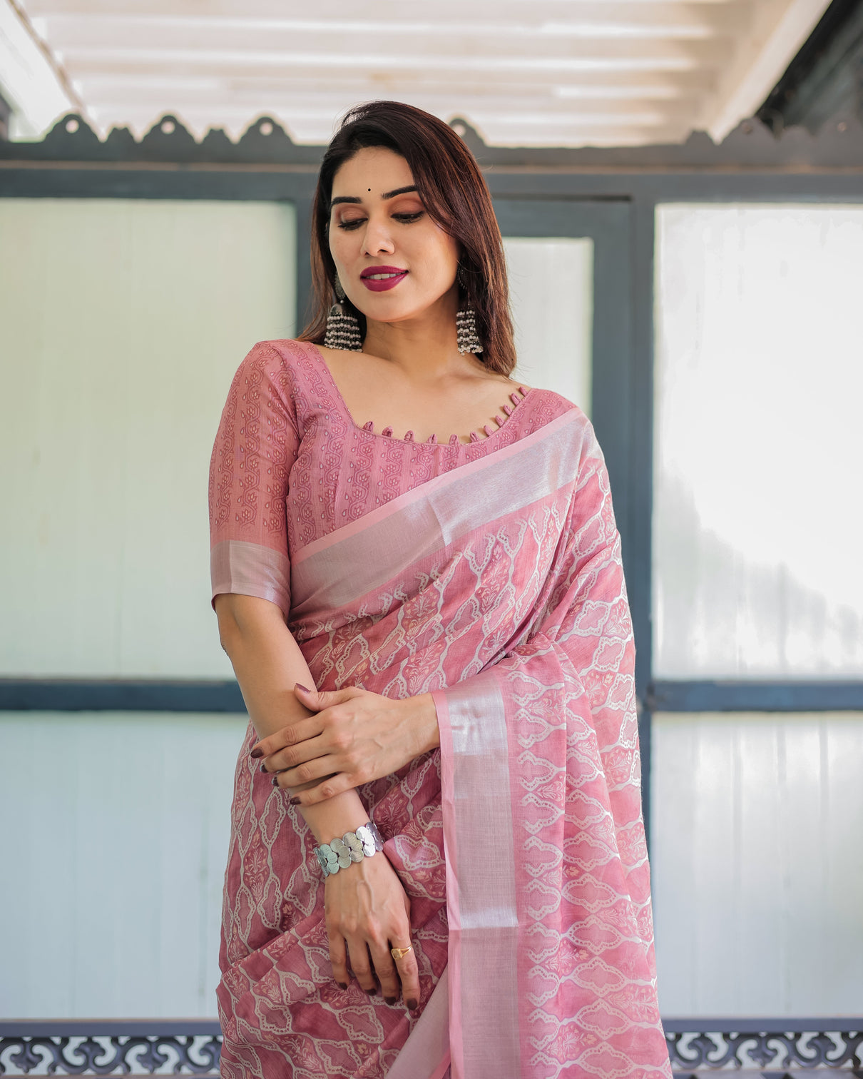 Elegant rose pink pure cotton linen saree with white thread work matching blouse and tassel edges