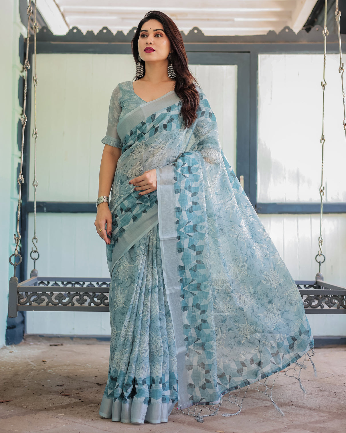 Light blue pure cotton linen saree with geometric and floral patterns blouse and tassels