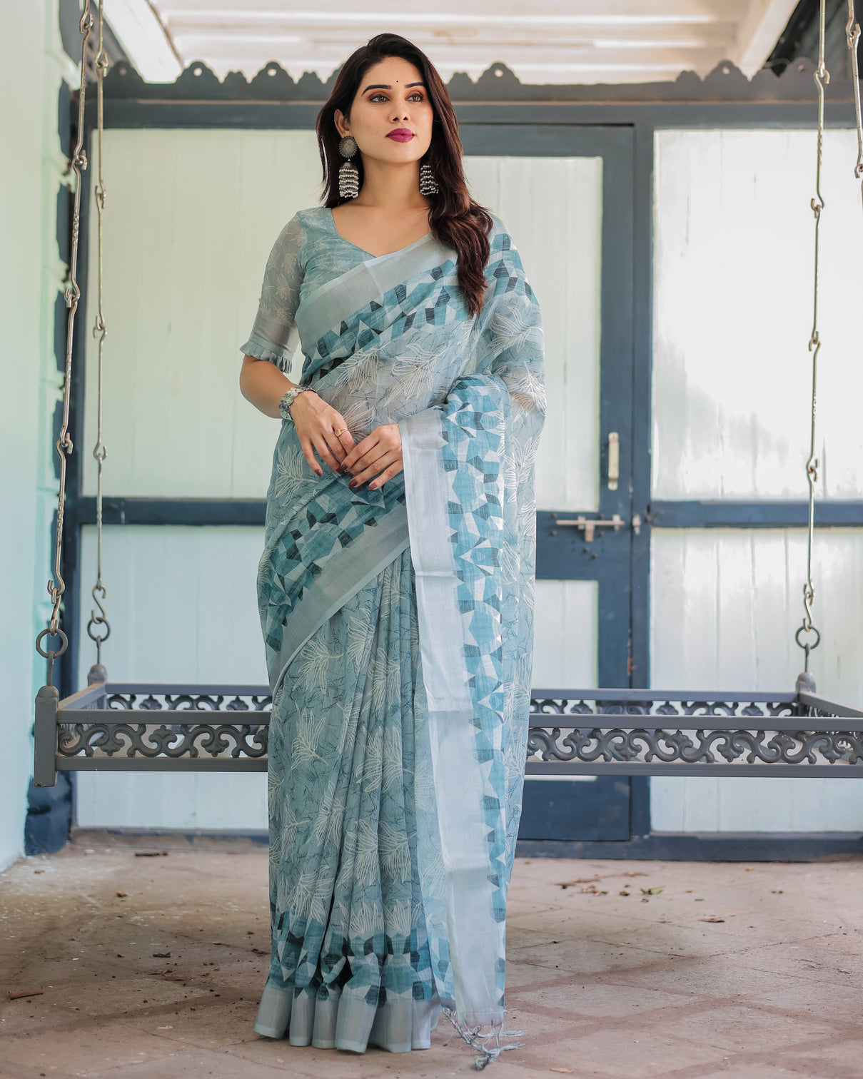 Light blue pure cotton linen saree with geometric and floral patterns blouse and tassels