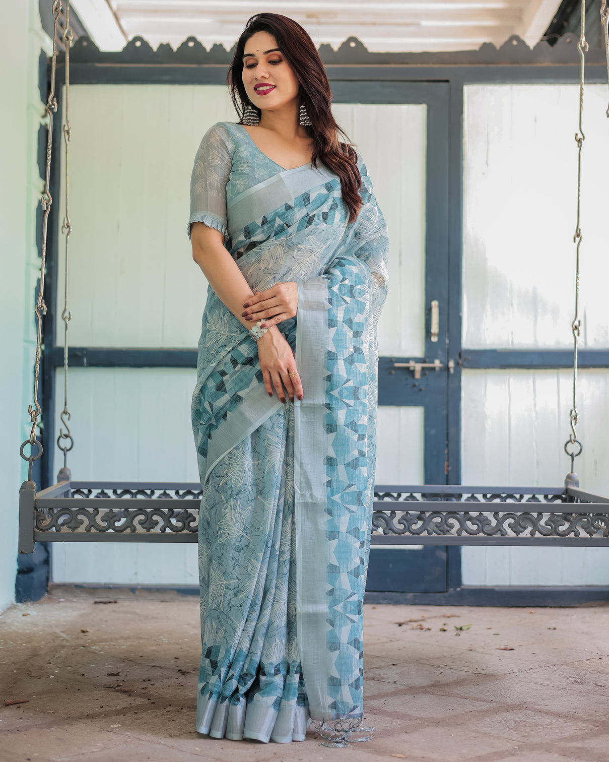 Light blue pure cotton linen saree with geometric and floral patterns blouse and tassels