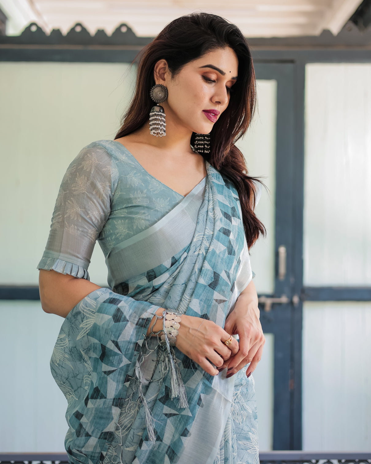 Light blue pure cotton linen saree with geometric and floral patterns blouse and tassels