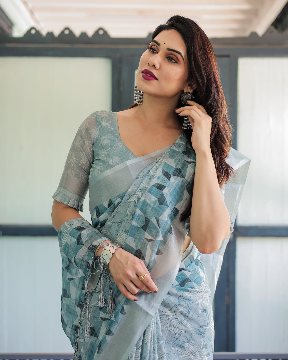 Light blue pure cotton linen saree with geometric and floral patterns blouse and tassels