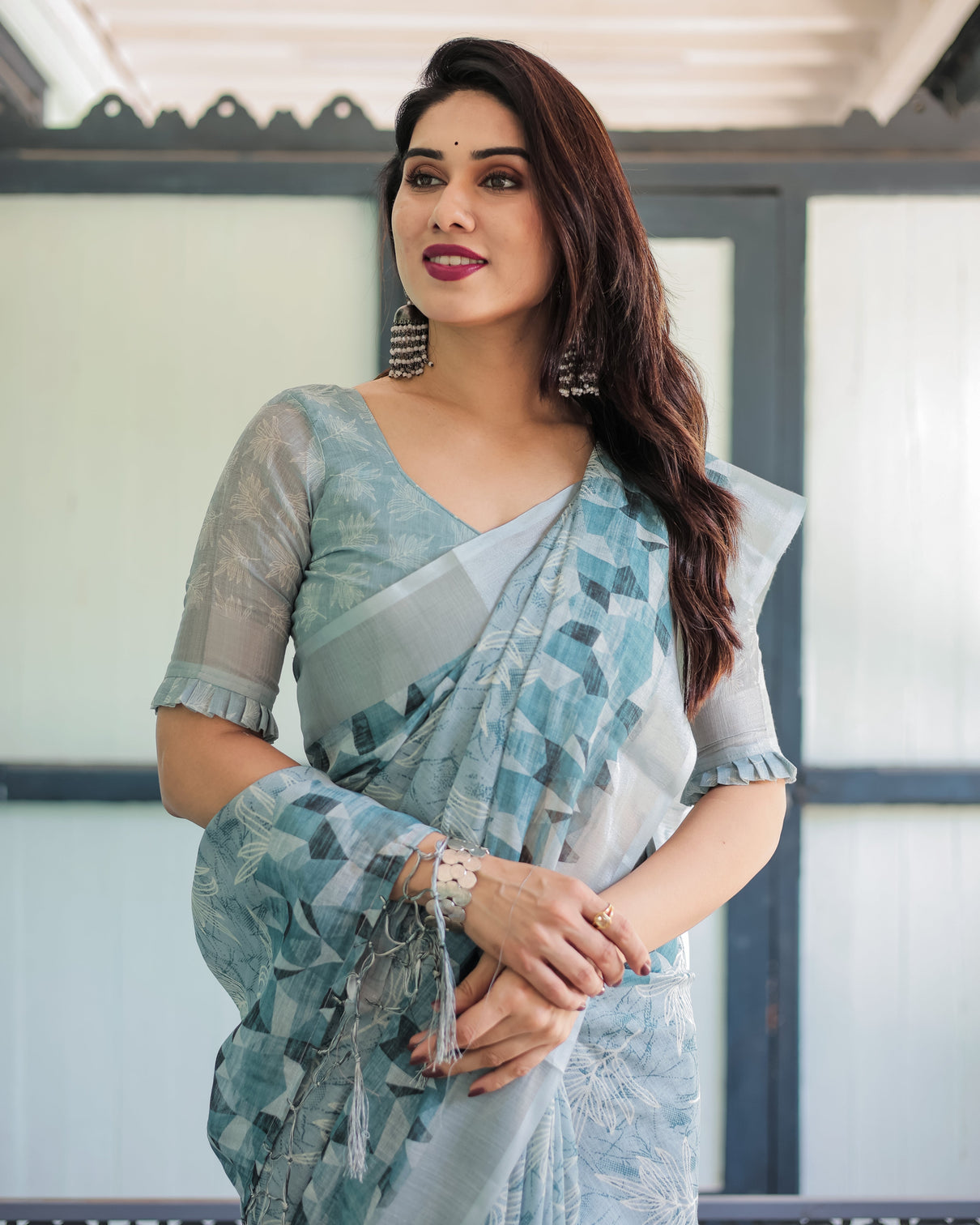 Light blue pure cotton linen saree with geometric and floral patterns blouse and tassels