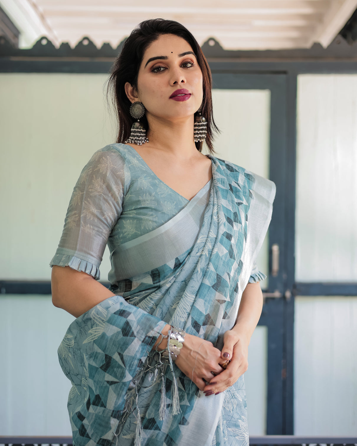 Light blue pure cotton linen saree with geometric and floral patterns blouse and tassels