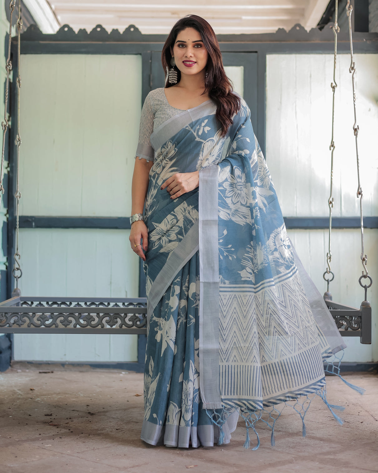 Pastel blue floral and geometric printed cotton linen saree with blouse and tassel edges