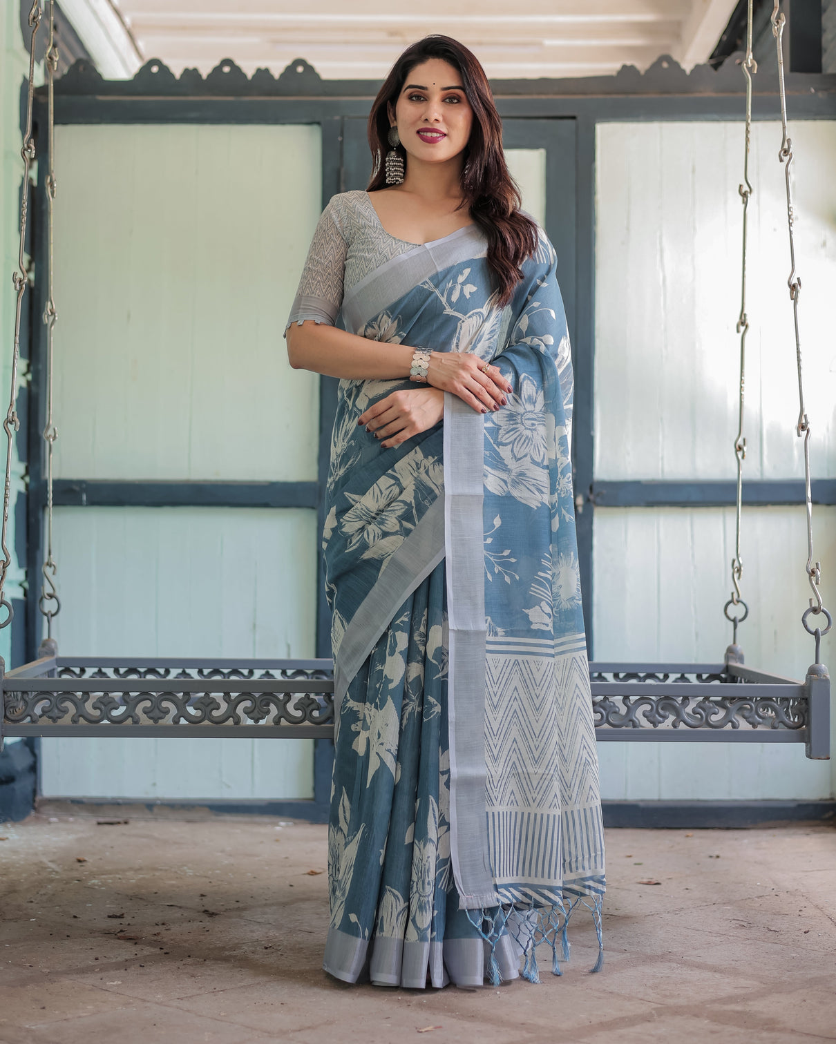 Pastel blue floral and geometric printed cotton linen saree with blouse and tassel edges
