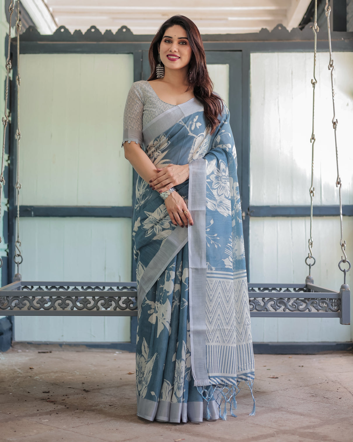 Pastel blue floral and geometric printed cotton linen saree with blouse and tassel edges