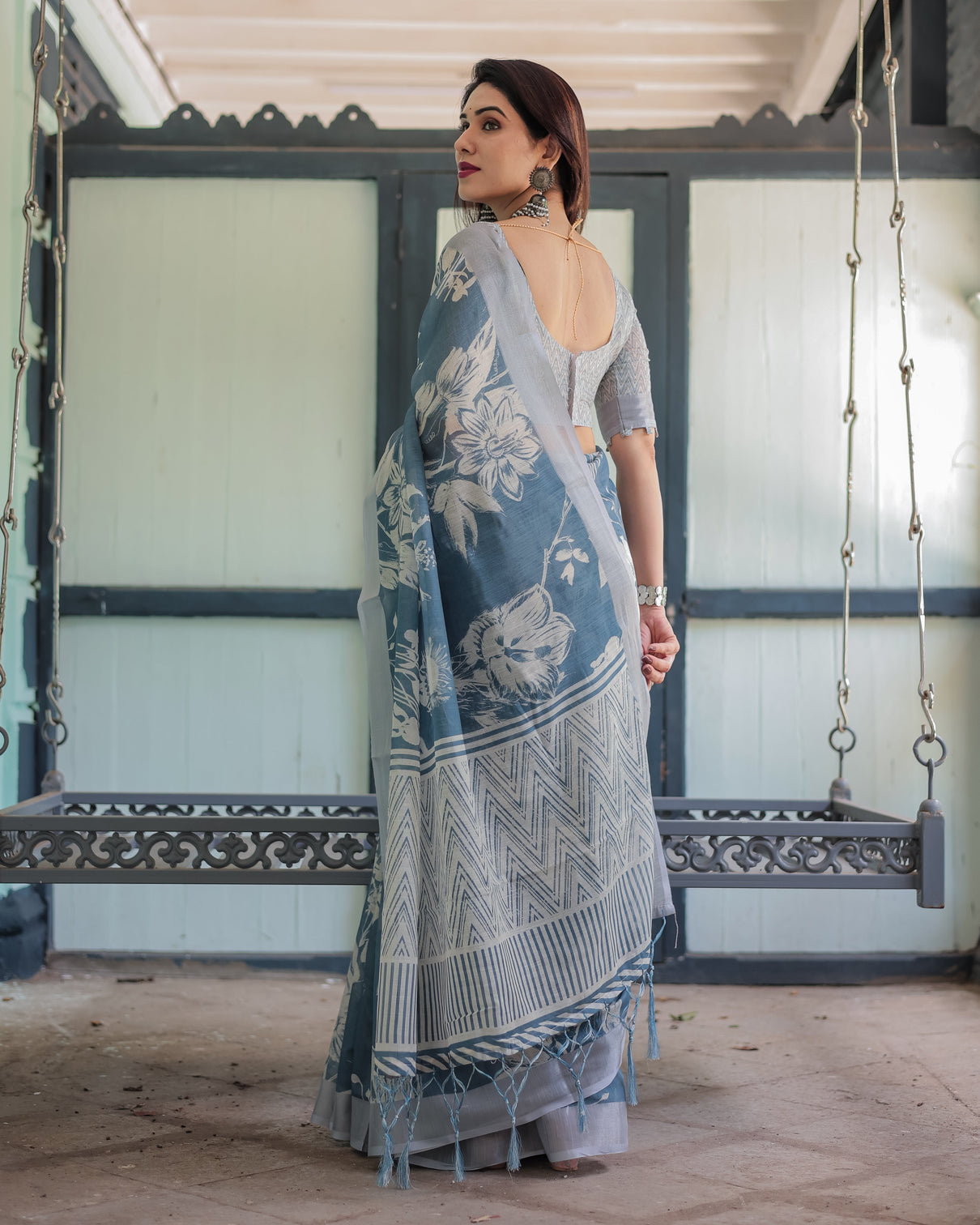 Pastel blue floral and geometric printed cotton linen saree with blouse and tassel edges