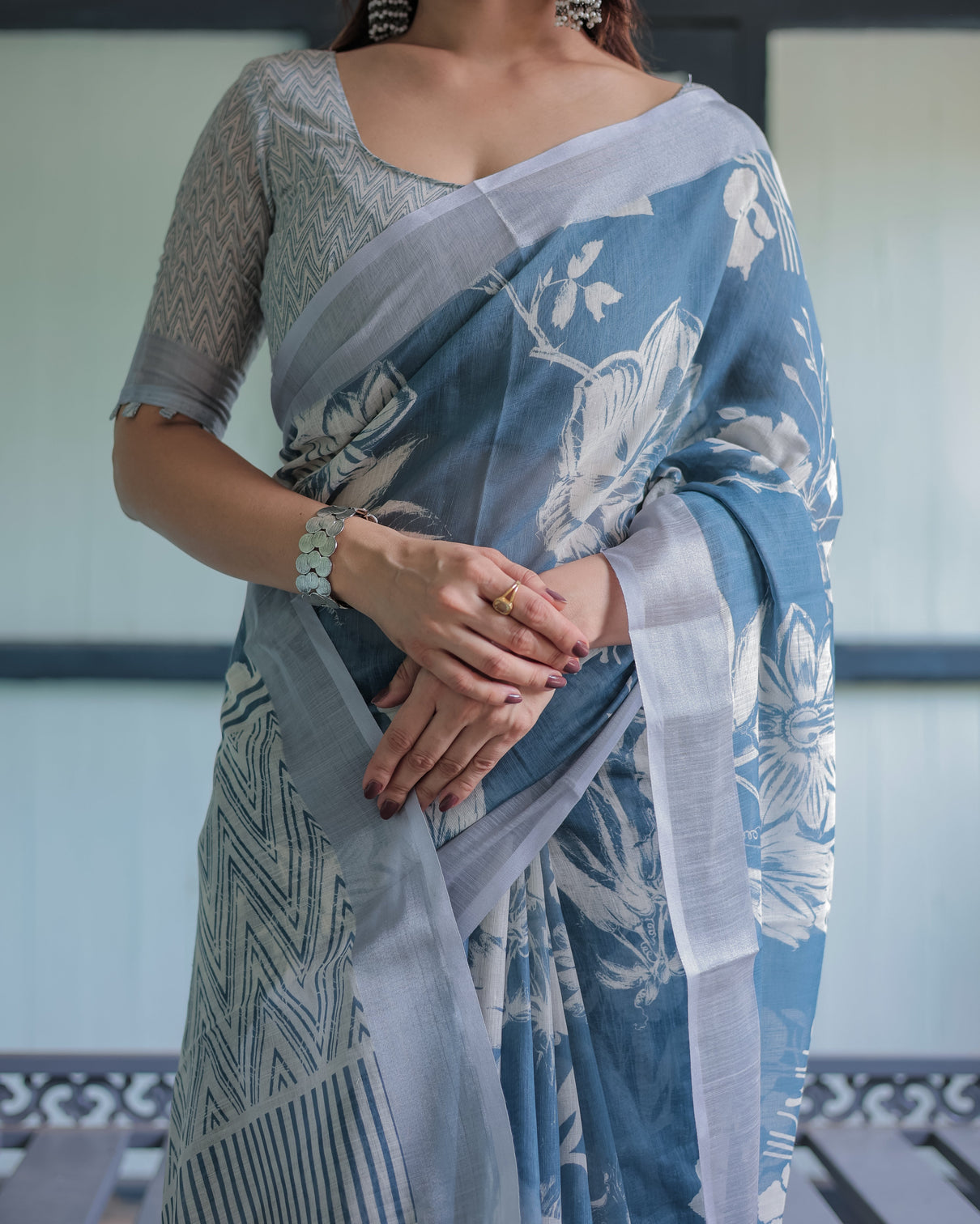 Pastel blue floral and geometric printed cotton linen saree with blouse and tassel edges