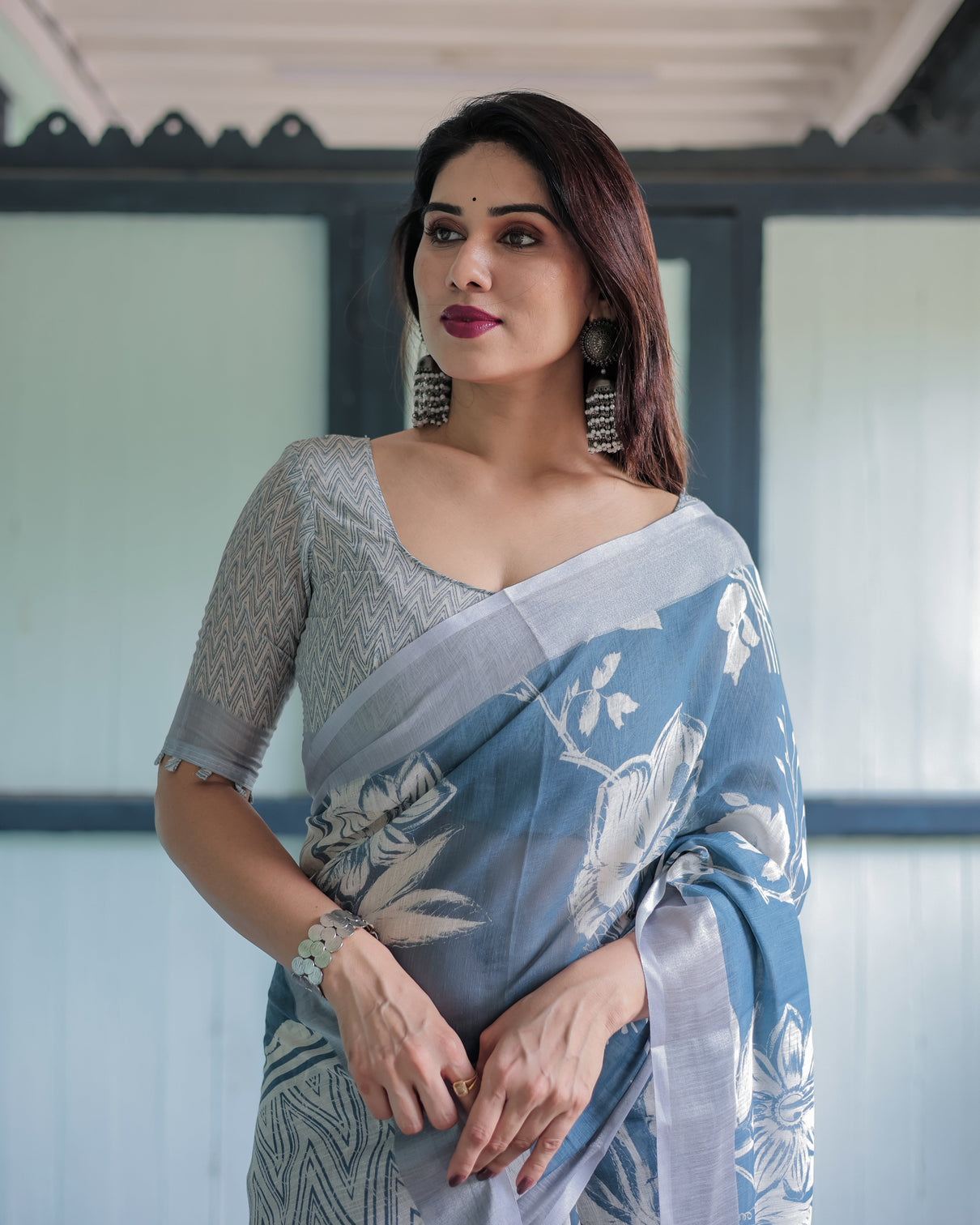 Pastel blue floral and geometric printed cotton linen saree with blouse and tassel edges