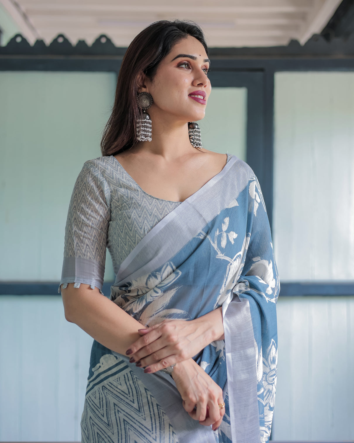 Pastel blue floral and geometric printed cotton linen saree with blouse and tassel edges