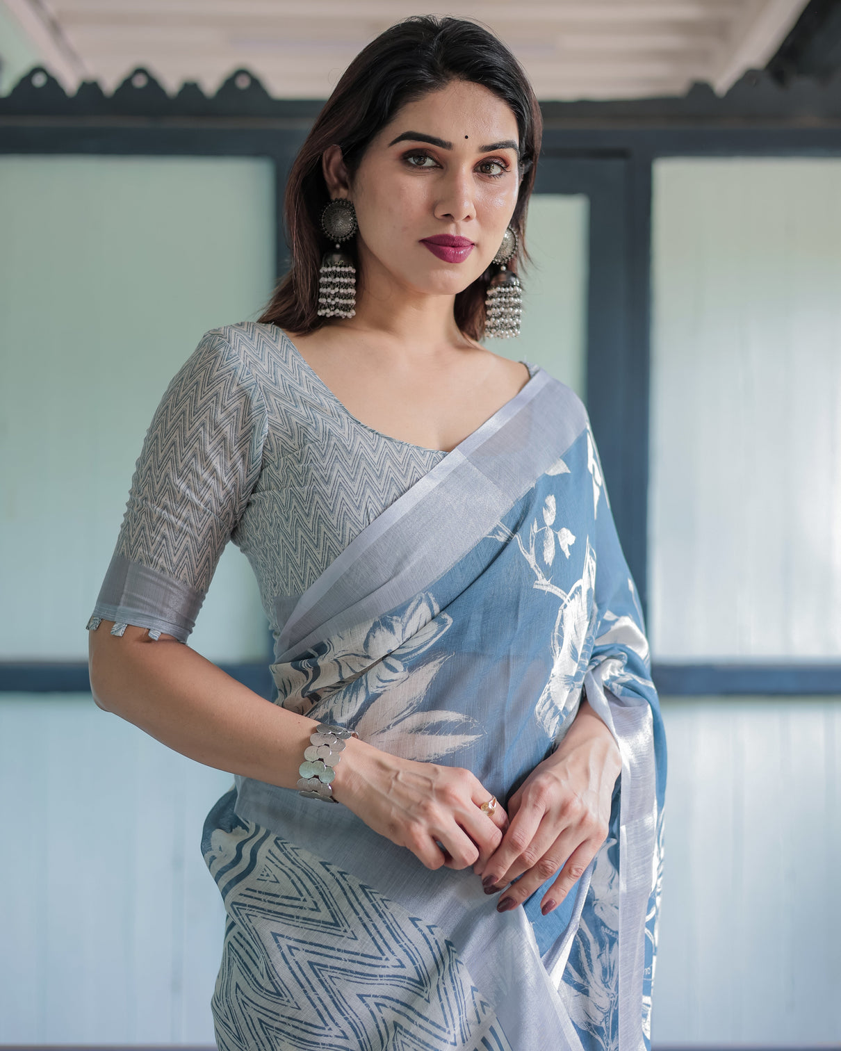Pastel blue floral and geometric printed cotton linen saree with blouse and tassel edges
